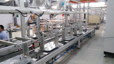 Pedal, variable speed joystick assembly line